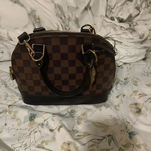 Small checkered purse with red interior